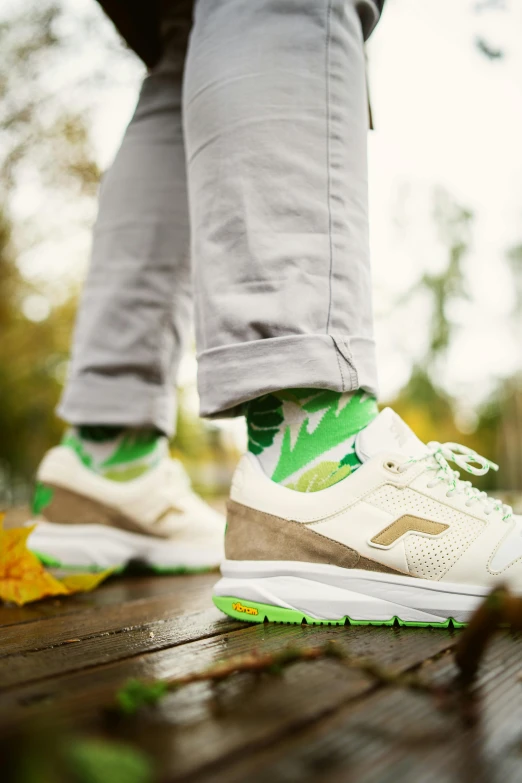 a person wearing running shoes stands on a porch