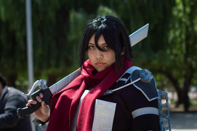 an attractive woman with a sword on her shoulders