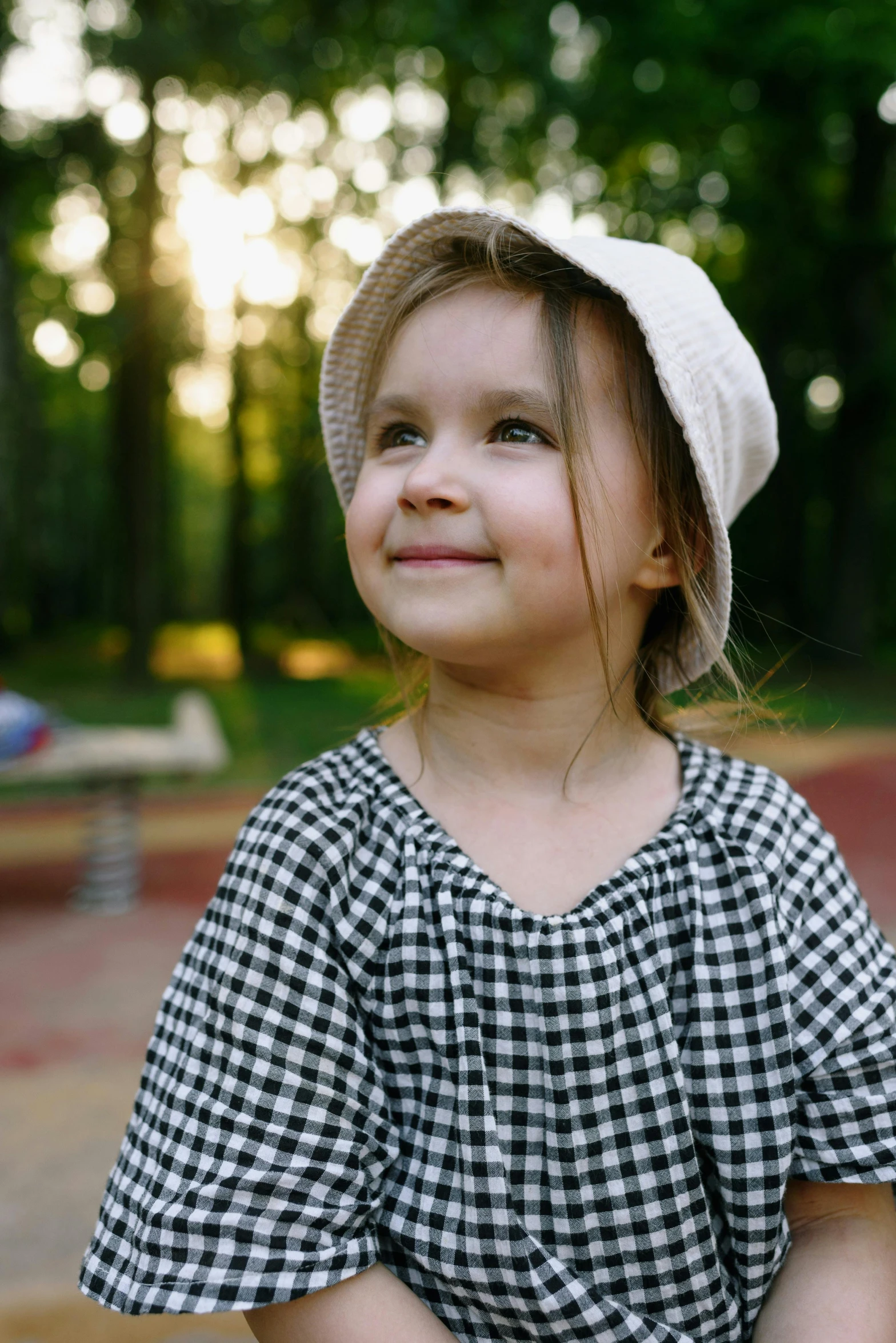 a  with a hat on a sunny day