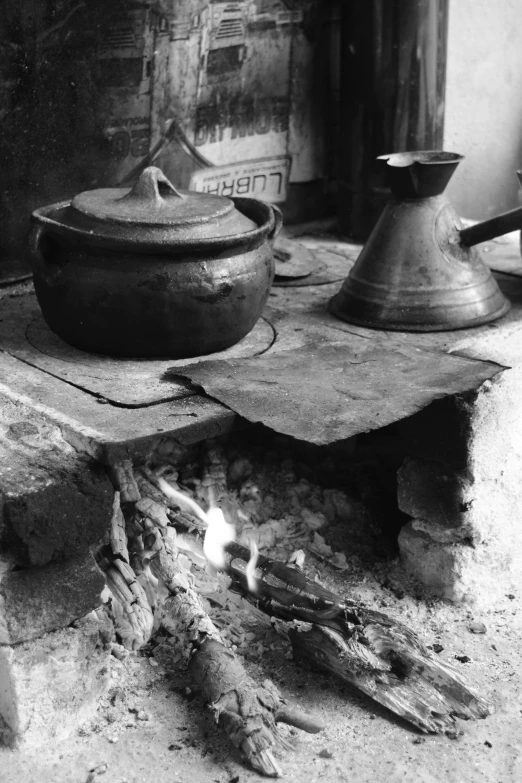 old pots are lit on a camp stove