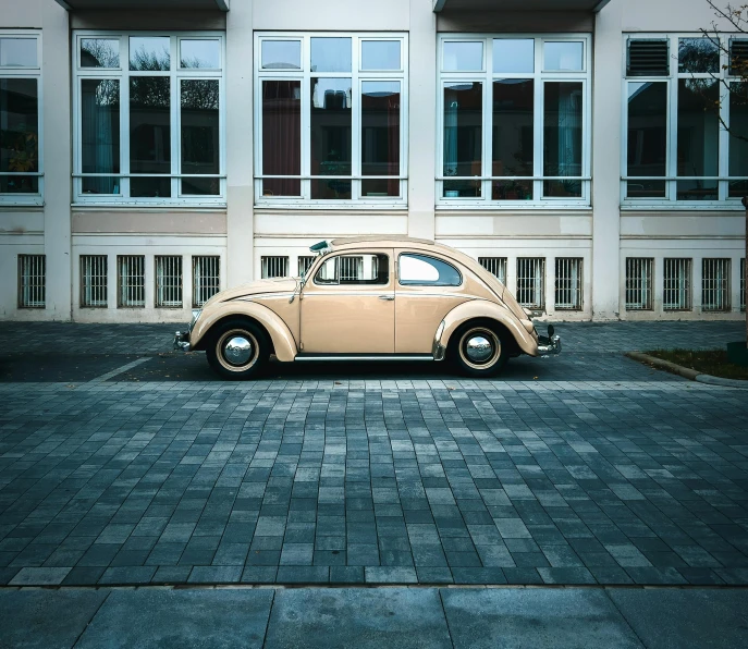 an old car parked in front of a building