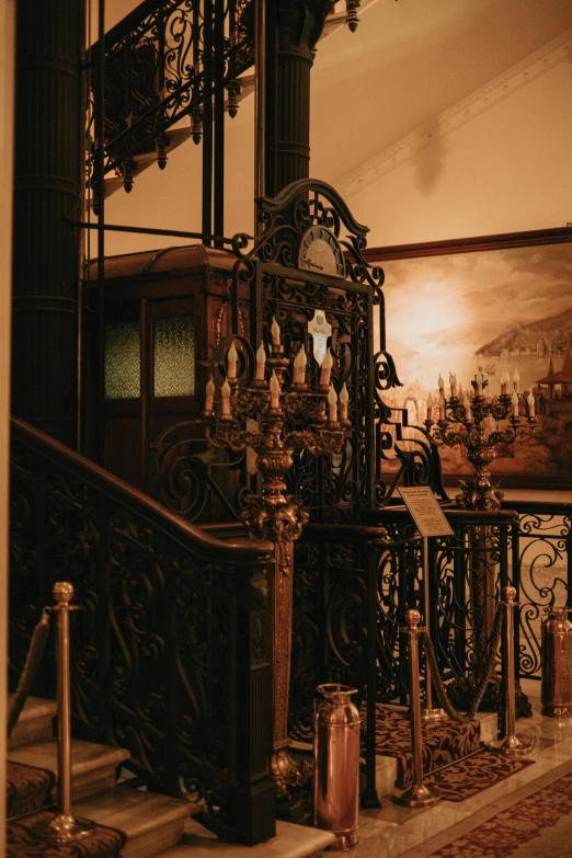 the inside staircase has decorative gold decorations on it