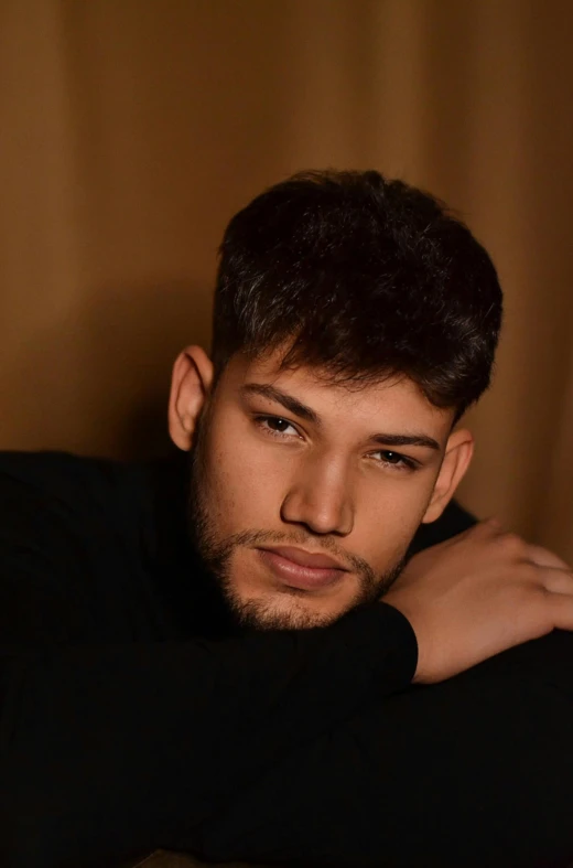 an image of a young man with his arm on his shoulder