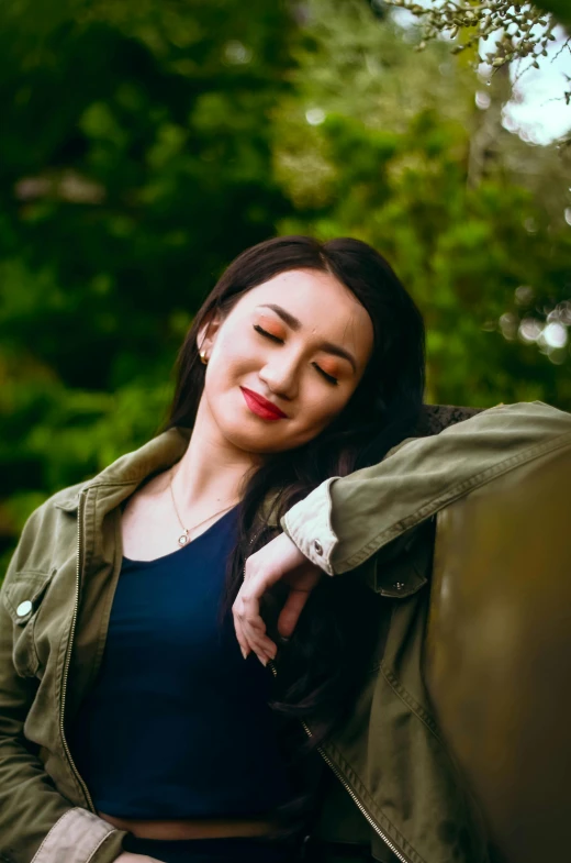 a woman posing with her arm around herself