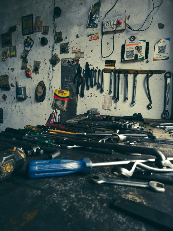 a bunch of tools are laying out on the wall