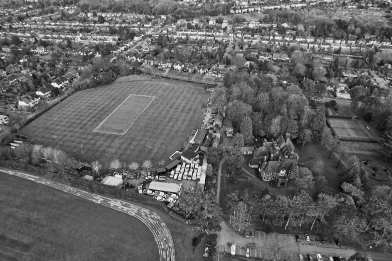 an aerial s of a tennis court in the park area