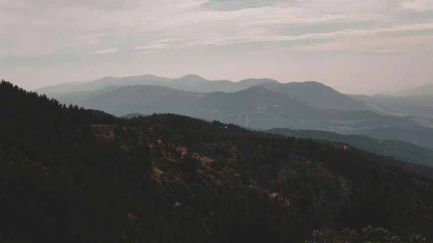 mountain landscape from above with trees and hills in the background