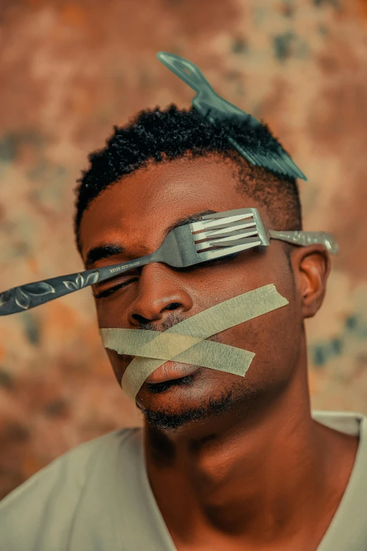 a man with tape wrapped around his face and mustache