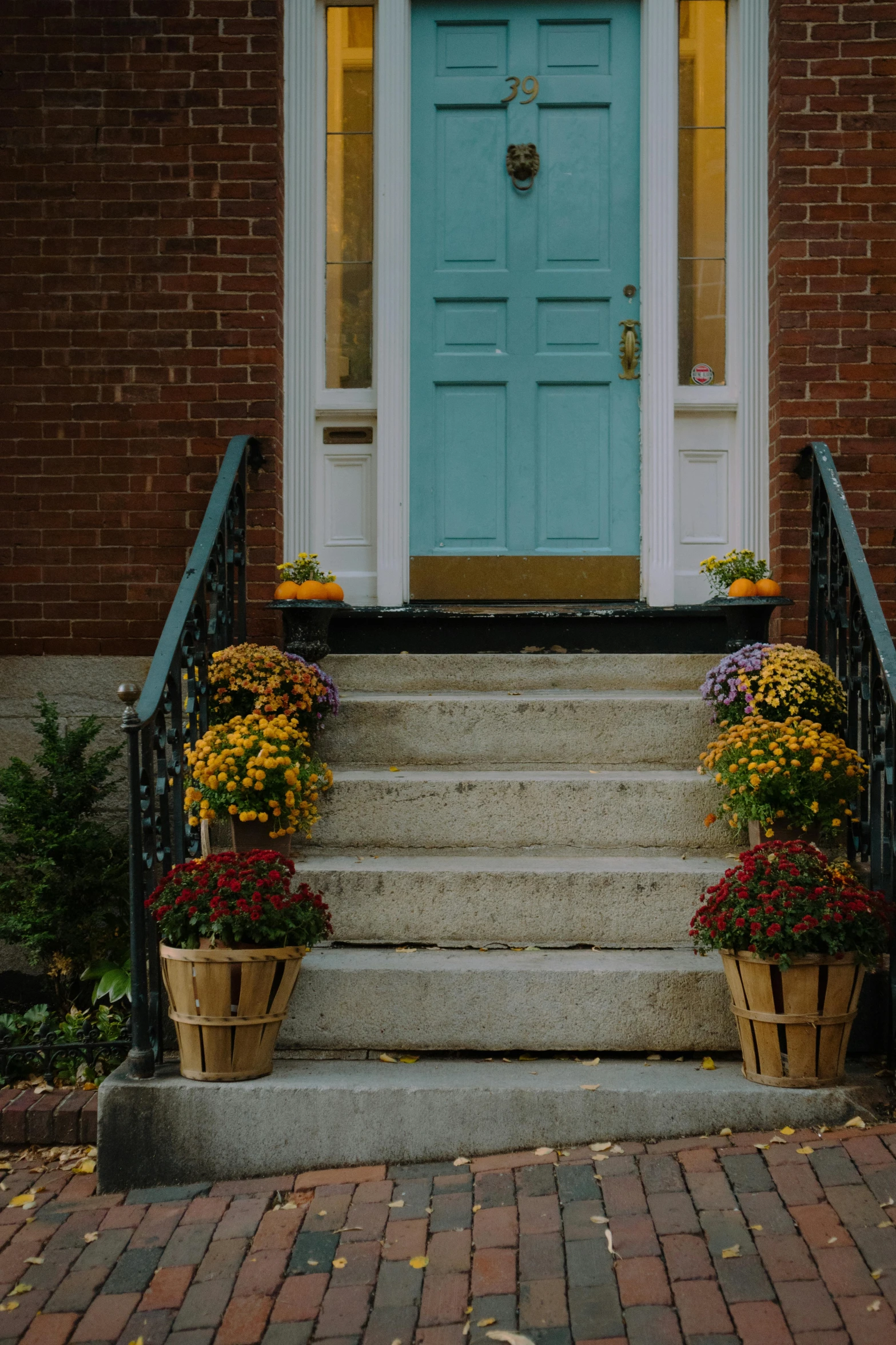 a trio of flower boxes sits at the base of stairs