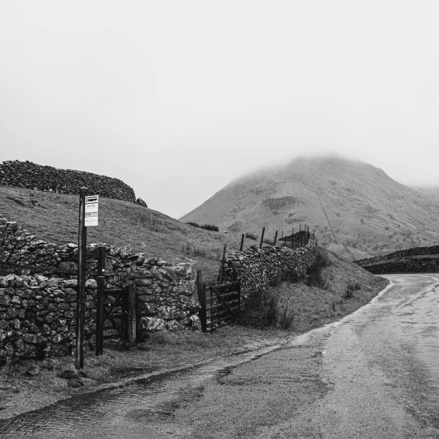 a mountain side road surrounded by dry stone walls