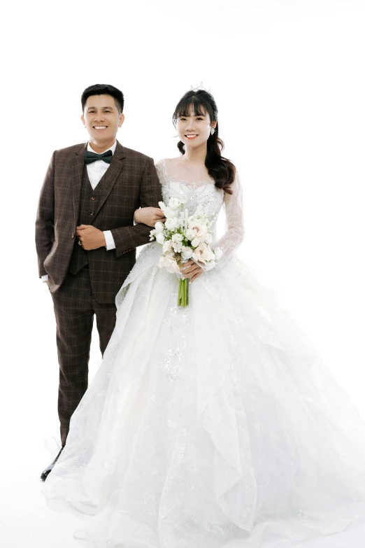 young asian couple posing for a pograph in wedding clothes