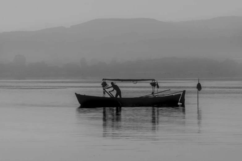 a group of men in boat on water