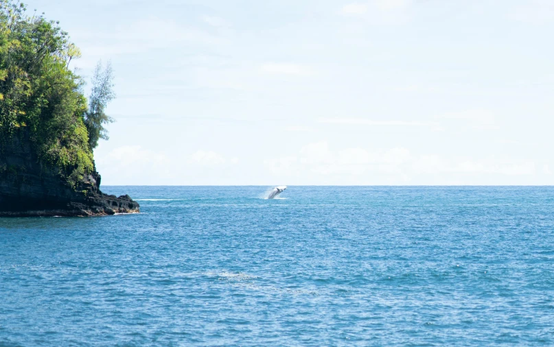 a lone boat sails through the water