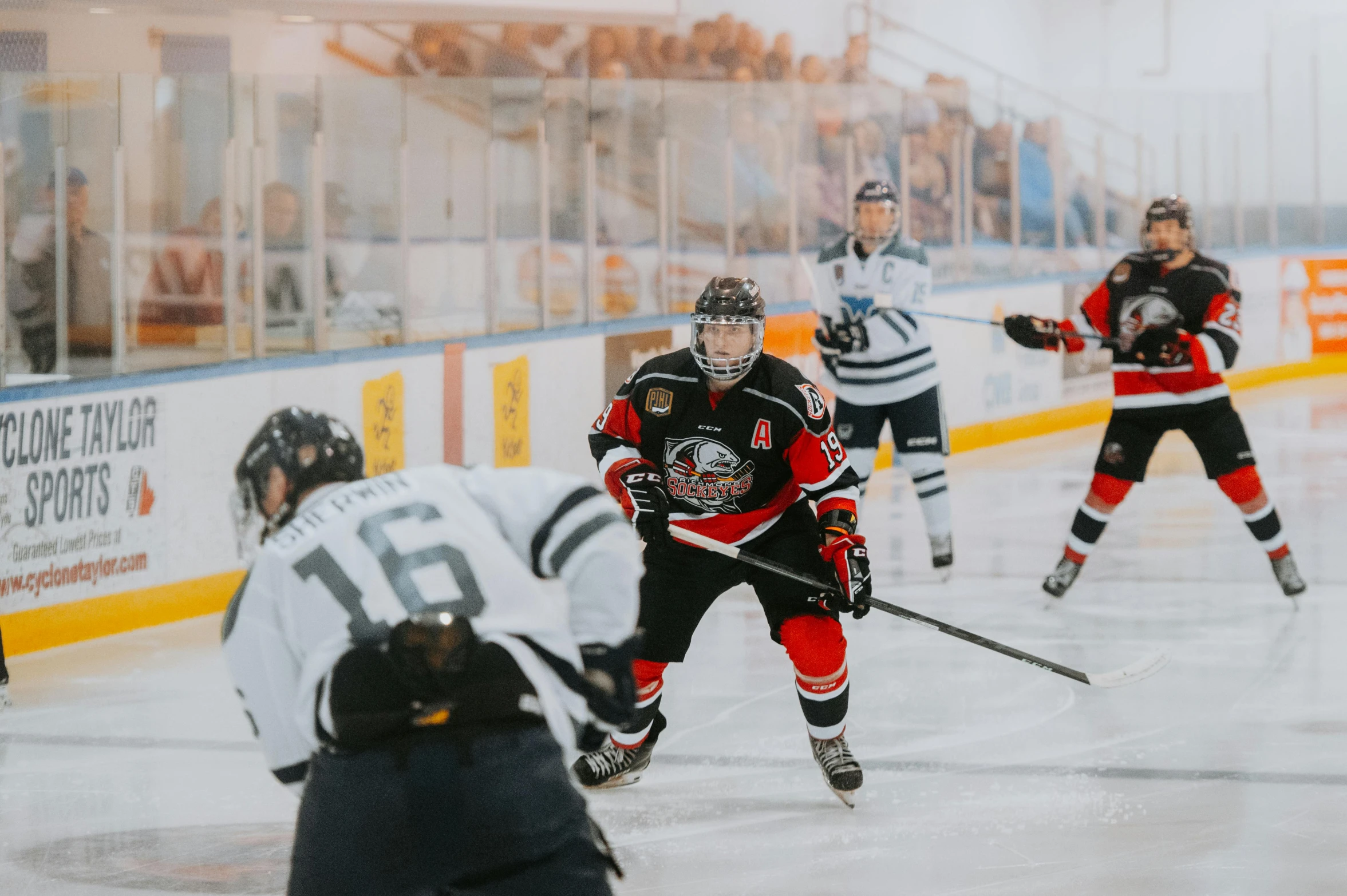 the hockey players are playing against each other