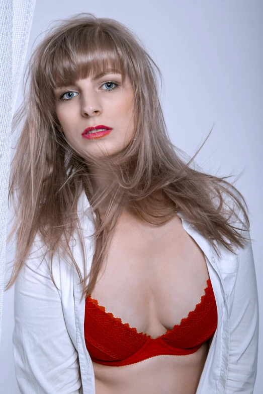 a woman with very big  in a red and white  top