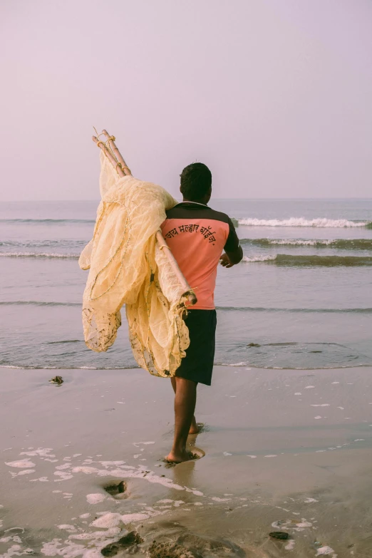 a man carrying an object on his back