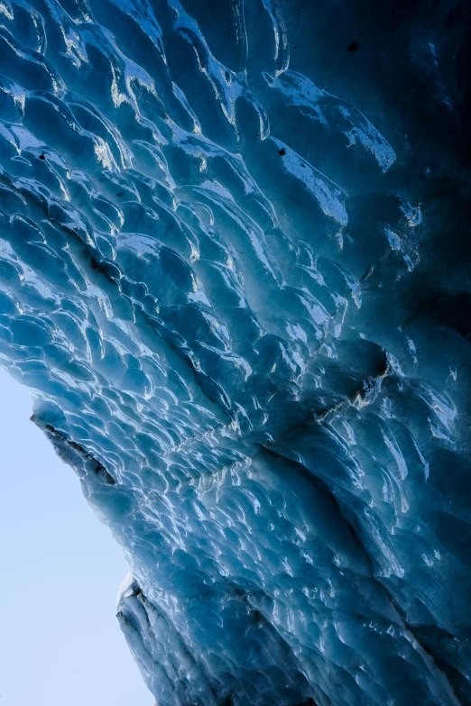 a very long wall of ice that looks like it is hanging down