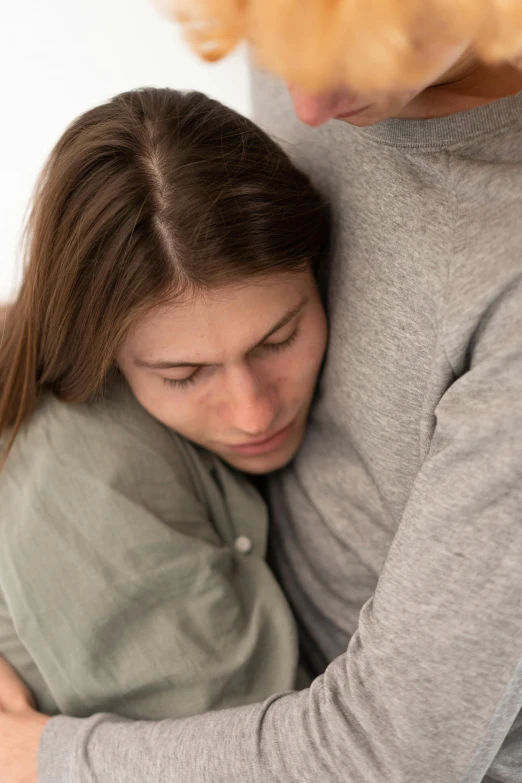 an adult woman holding onto her young child