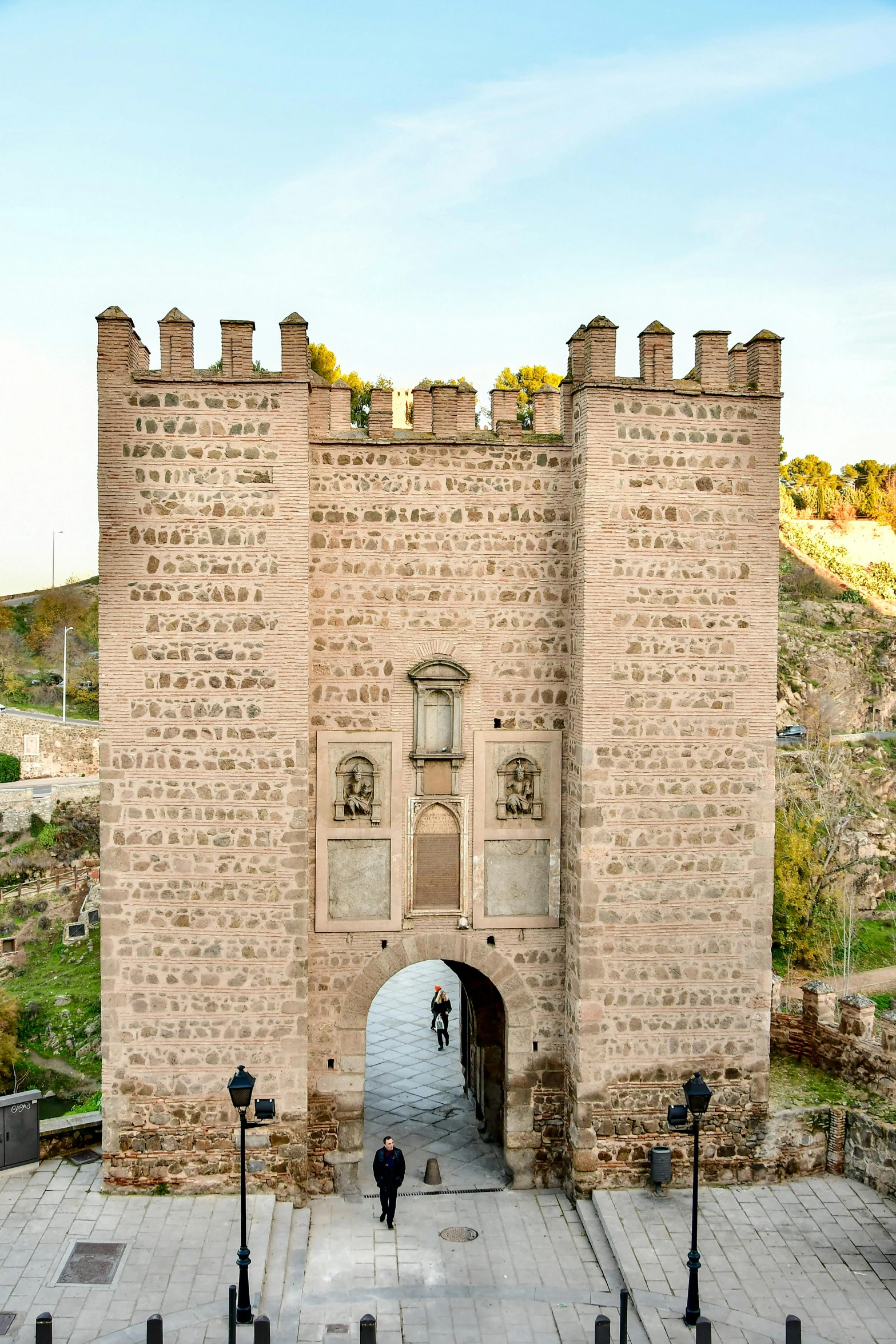 a brick building with doors leading to a ramp