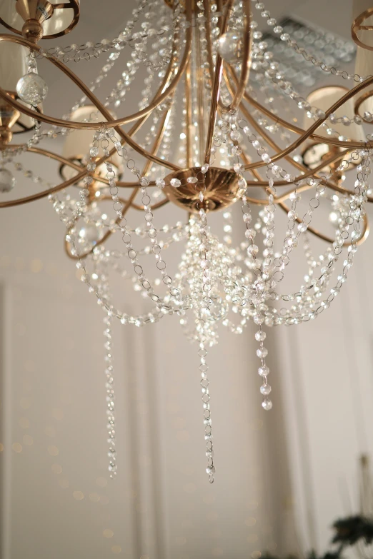 a chandelier is hanging from the ceiling