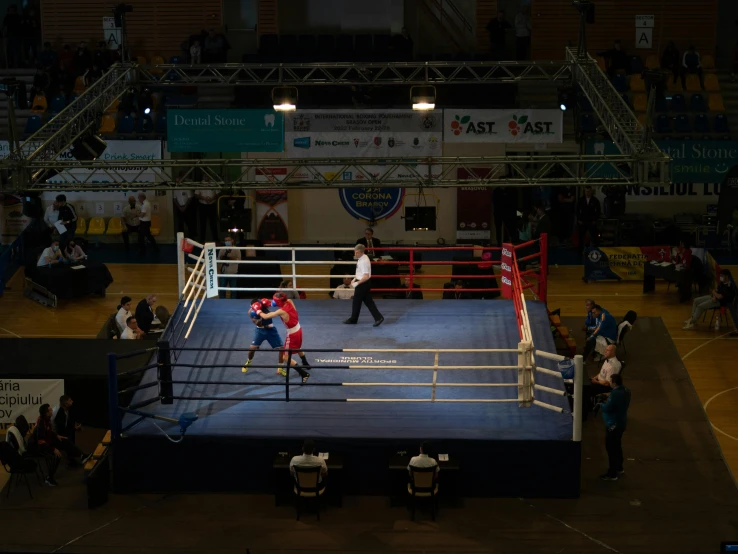 a boxing ring with a referee and a referee in it