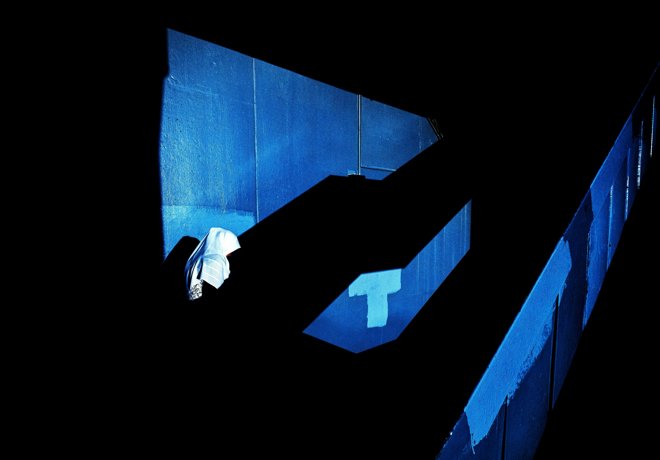 someone standing in a tunnel with a light