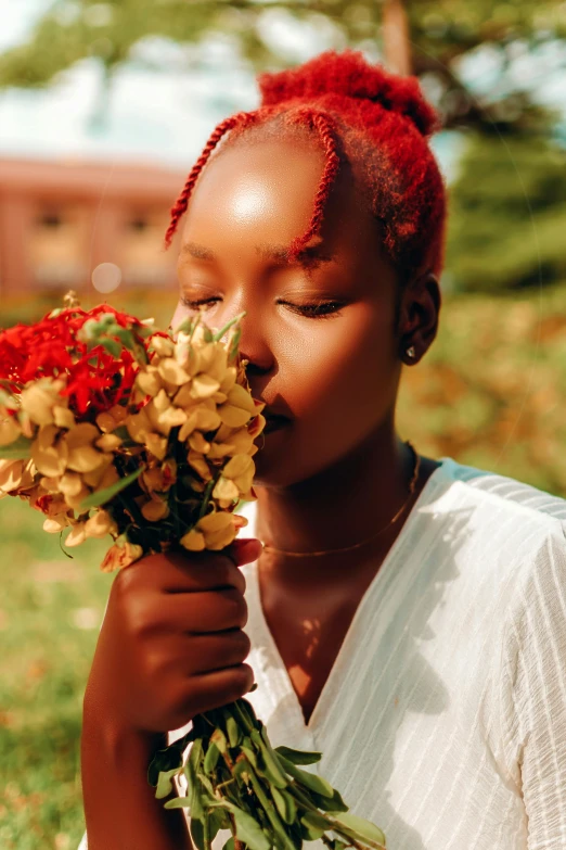 a young woman with flowers in her hand