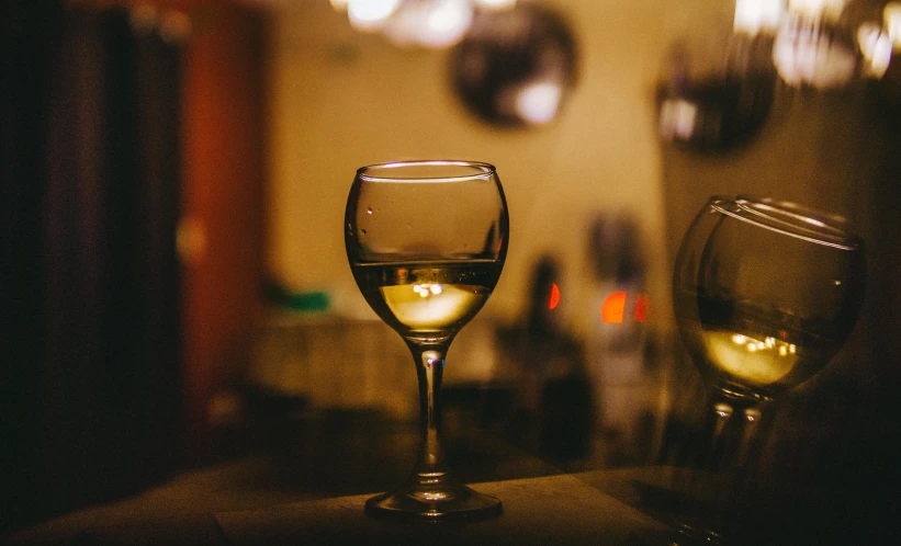 a couple of glasses are sitting on a table