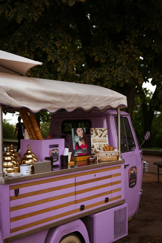 a purple truck with people on top of it