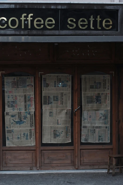 the front door to coffee suite with newspaper covering on them