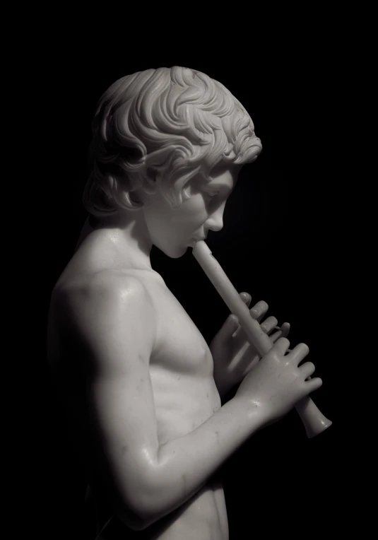 a sculpture of a boy with an instrument