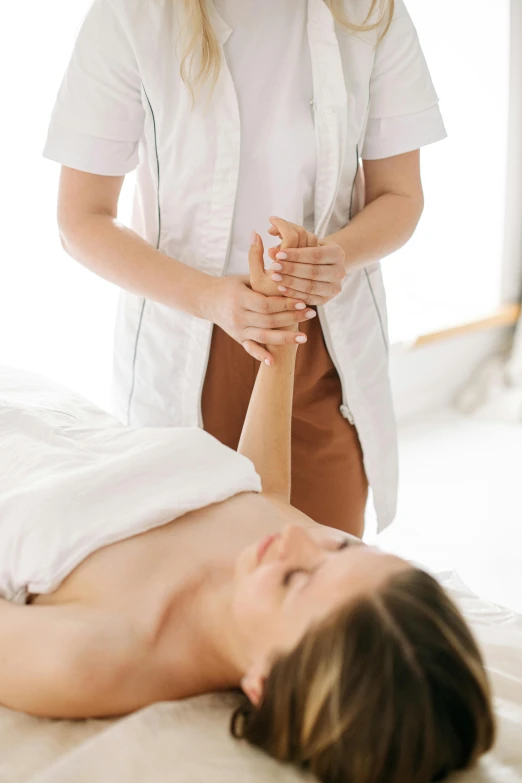 a woman getting a massage by an experienced massageist