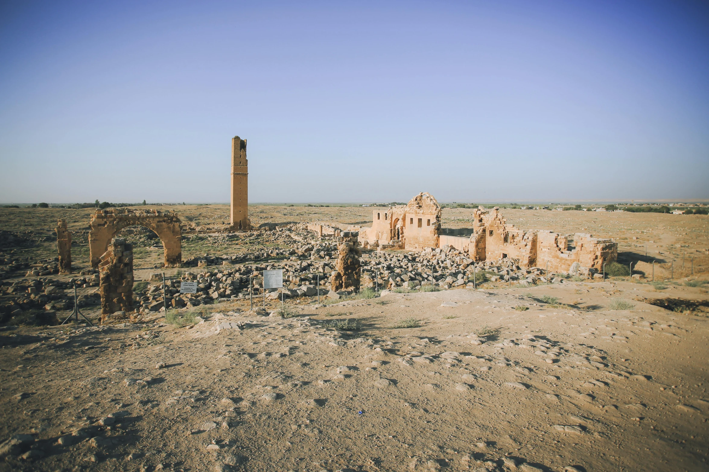 a dry desert scene with lots of tall buildings