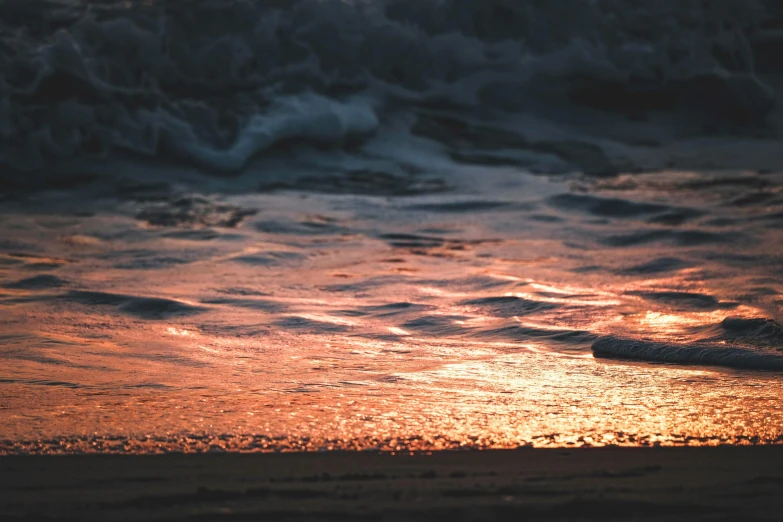 waves come in towards the shore and the ocean