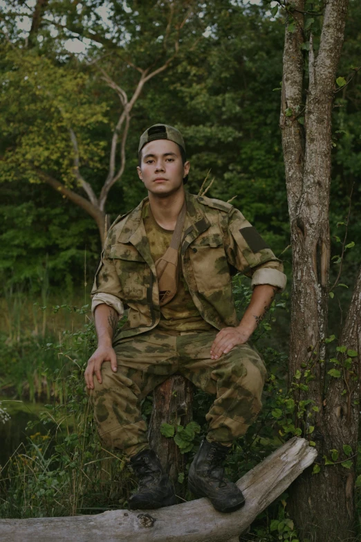 an old fashion soldier sits on a wooden log