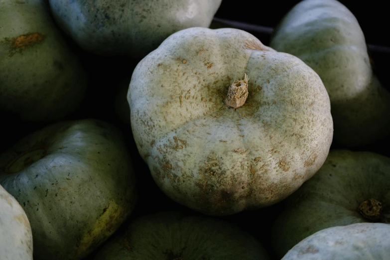 a pile of green apples sitting next to each other