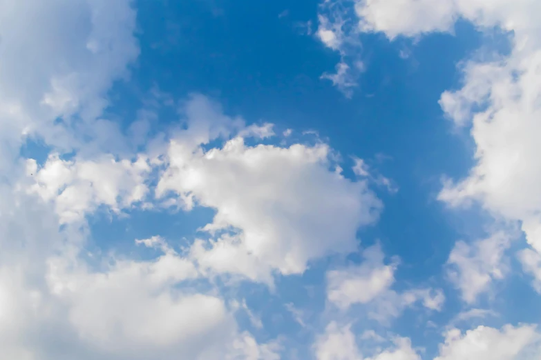 the sky has a very large white puffy cloud