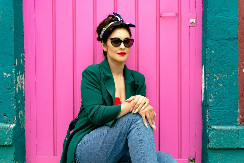 a woman with her feet up sitting in front of a door