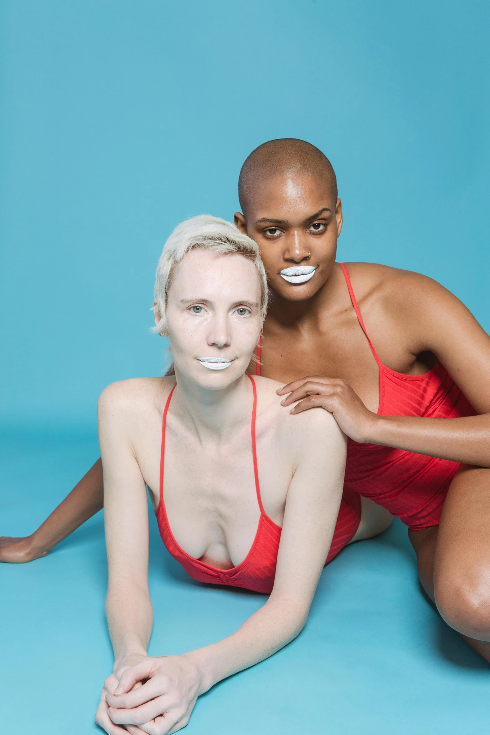 a man and woman pose for a po with fake teeth