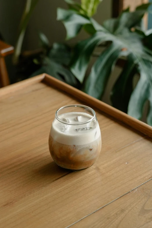 a small glass sitting on top of a table