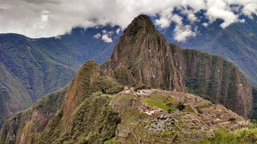 an image of an ancient structure built into a mountain side