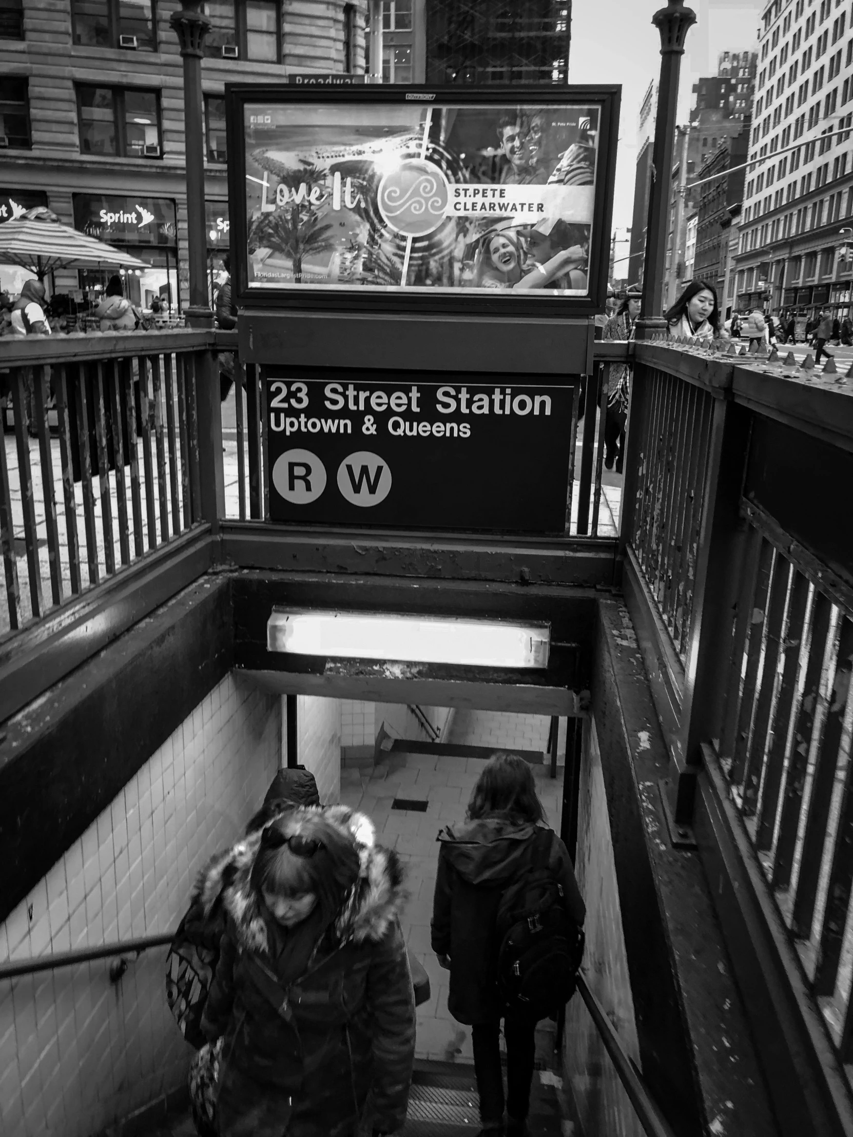 two women walking down a platform as they head down