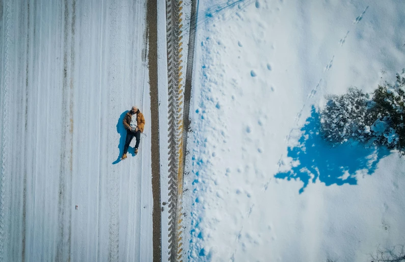 a man on skis snowing down a hill