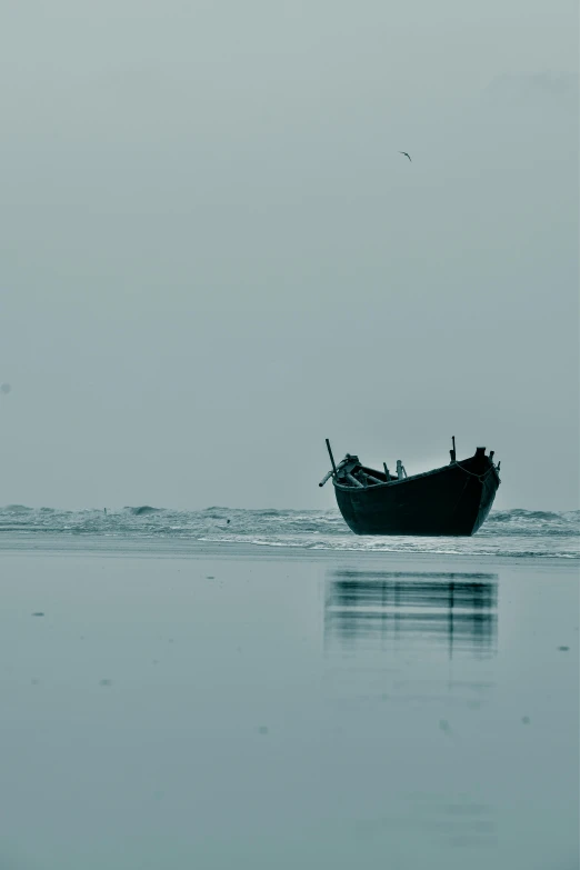 a large boat that is sitting in the sand