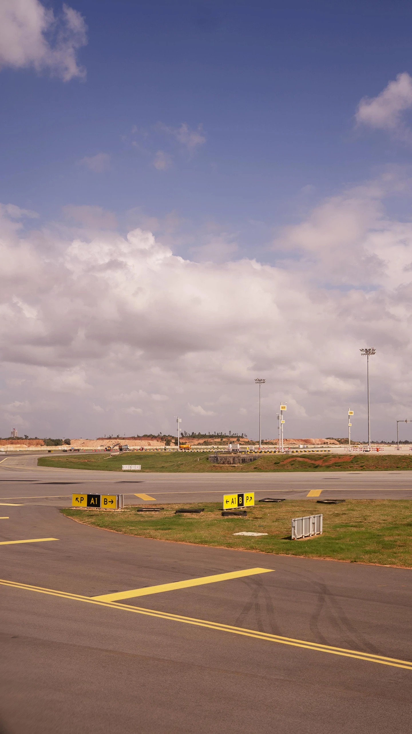 there is an air port with a parking lot in the background