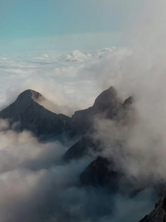 a mountain with some very tall peaks in the background