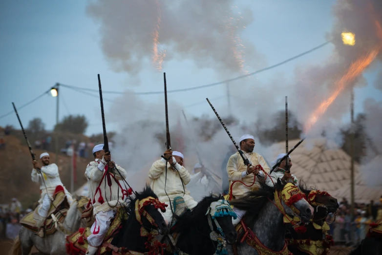 a bunch of people are riding horses in a crowd