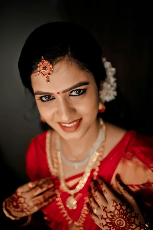 a beautiful woman in red dress with jewellery