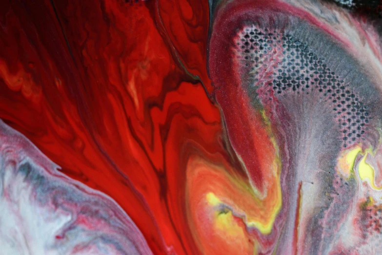 an abstract painting shows a red piece of art