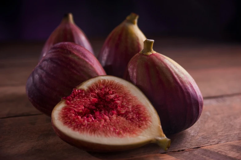 there is a fig with a bite taken out of it